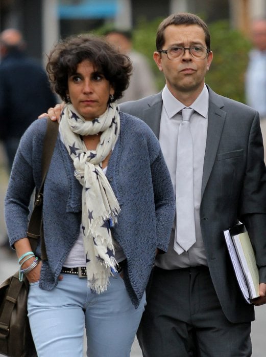 Former Bayonne's hospital doctor Nicolas Bonnemaison arrives with his wife, Julie Bonnemaison, at the courthouse of Pau, southwestern France, for the first day of his trial, Wednesday, June 11, 2014. Bonnemaison is accused having poisoned 7 terminally ill patients in 2010 and 2011. The trial comes amid debate in France over whether to legalize euthanasia or other means of ending medical care for terminally ill patients. AP Photo