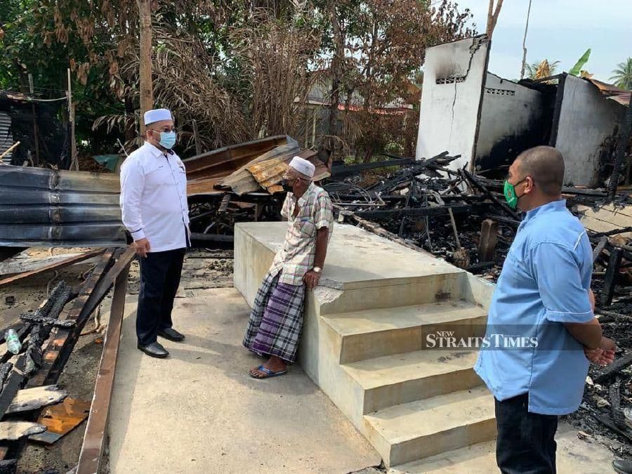 Labourer Yusuf Husin and his two family members lost all their belongings after their house was destroyed in a fire last week. - NSTP/ SHARIFAH MAHSINAH ABDULLAH