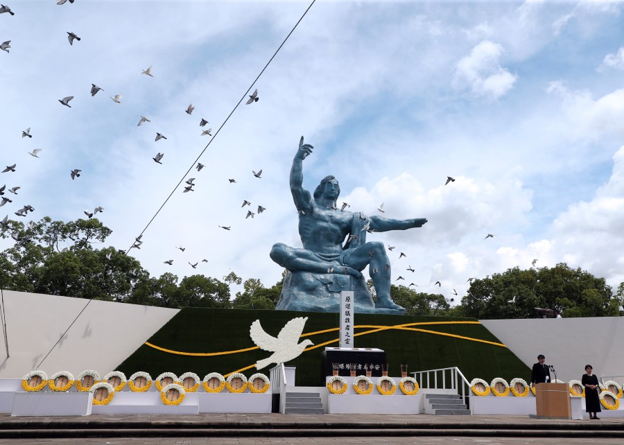  Doves are released during an official event at the Peace Park in Nagasaki, southern Japan. - EPA PIC