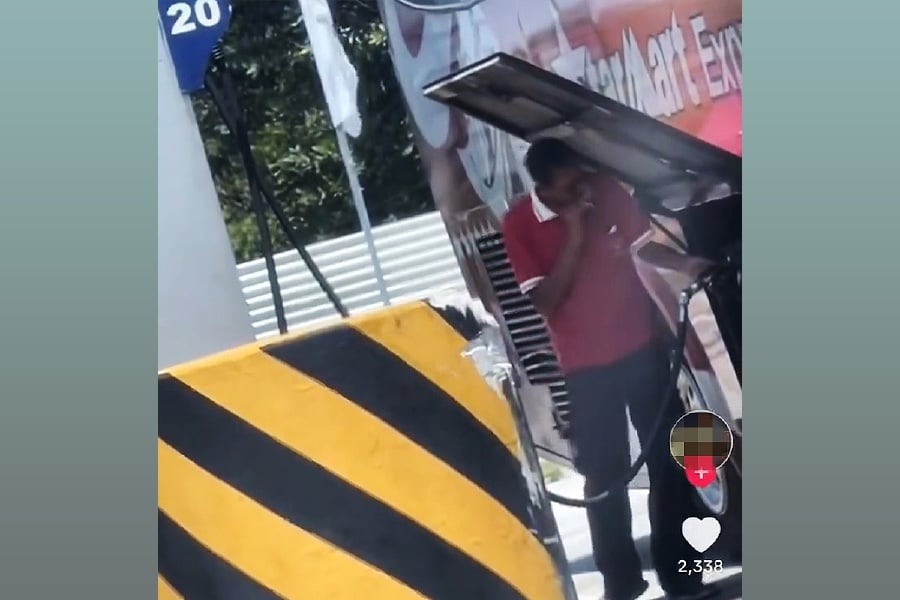 A video capturing a man smoking at a petrol station has ignited anger among social media users. - Video screenshot from X