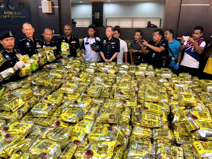 Bukit Aman Narcotics Crime Investigation Department director Datuk Seri Mohmad Salleh with the seized one tonne of syabu, worth a whopping RM54 million, in a raid at a store in Jelutong. Pix by Ramdzan Masiam