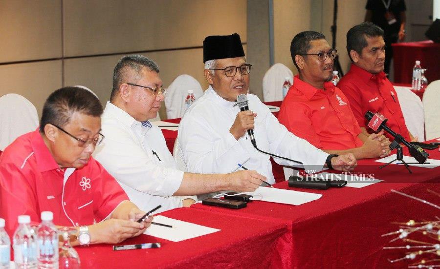 Parti Pribumi Bersatu Malaysia (Bersatu) secretary-general Datuk Seri Hamzah Zainudin  (centre) with party leaders, address the media after the party’s women's wing annual general meeting in  Kuala Lumpur . - NSTP/SAIFULLIZAN TAMADI