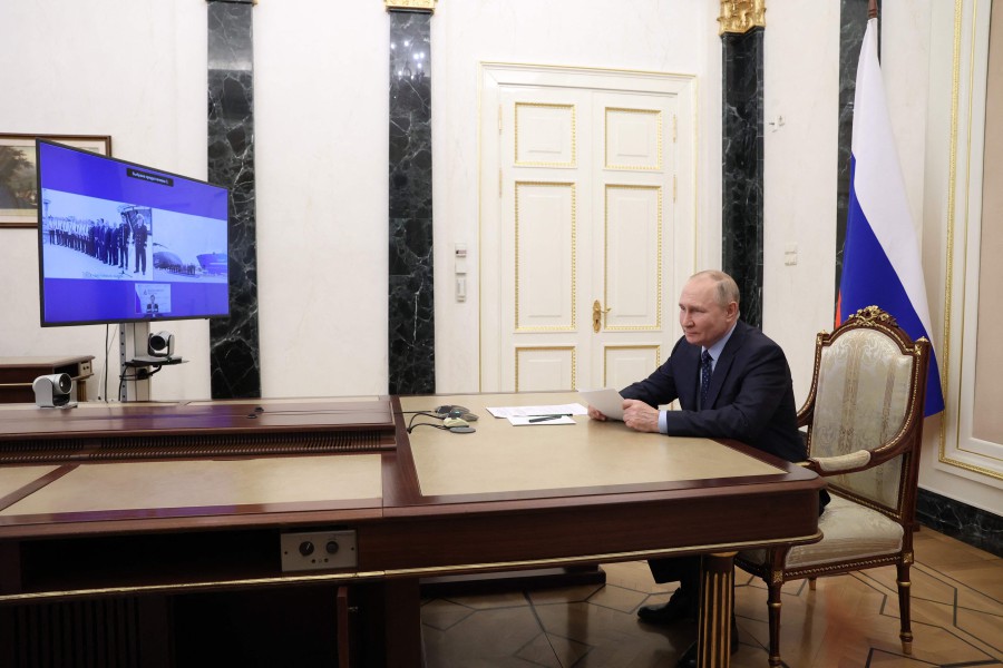 Russian President Vladimir Putin takes part in a ceremony to raise the national flag on new fishing vessels built at domestic shipyards under the programme for upgrading production capacities of the fishery industry with state support, via video link at the Kremlin in Moscow. - AFP PIC