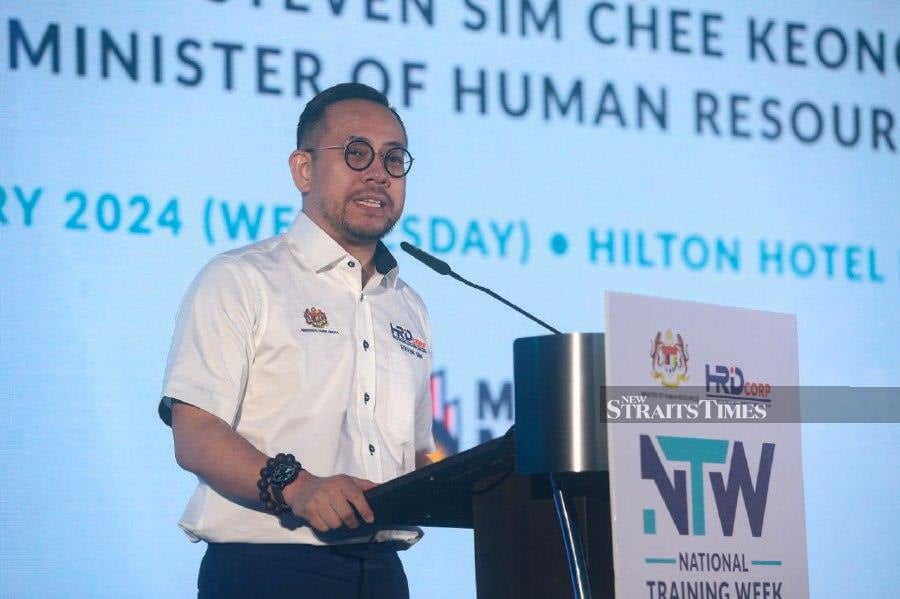 Human Resource Minister Steven Sim delivers his speech during the National Training Week 2024 launch in Kuala Lumpur. -NSTP/GENES GULITAH