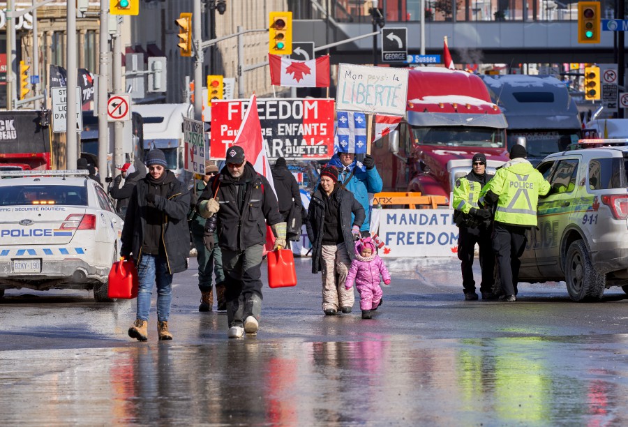  People bring gas tanks to truckers to continue their occupation near the Canadian parliament hill. - EPA PIC