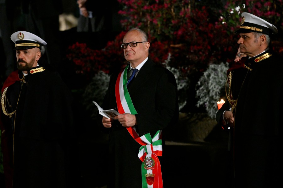 Rome's mayor Roberto Gualtieri attends the Way of the Cross (Via Crucis) at the Colosseum as part of the Holy Week celebrations, on March 29 in Rome. Pope Francis pulled out of Friday's Way of the Cross ceremony at the last minute, with the Vatican saying he wanted to "preserve his health" ahead of other Easter events this weekend. -- Pic: AFP