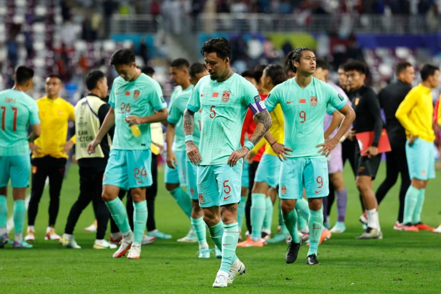 China's defender Zhang Linpeng and forward Zhang Yuning react after the Qatar 2023 AFC Asian Cup Group A football match between Qatar and China at Khalifa International Stadium in Doha. - APF PIC