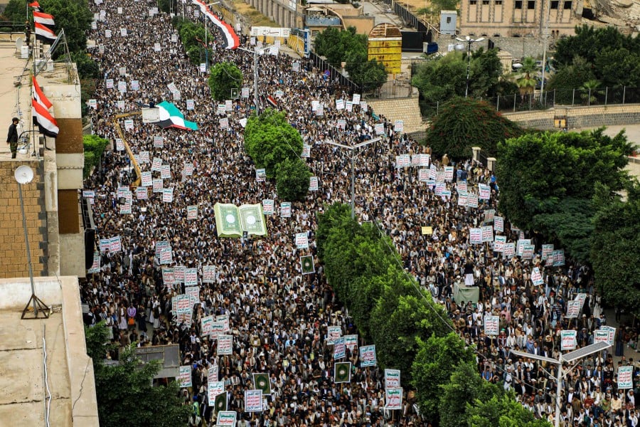 Demonstrators march in a rally denouncing the burning of the Quran, Islam's holy book, in Sweden in Yemen's capital Sanaa. - AFP PIC