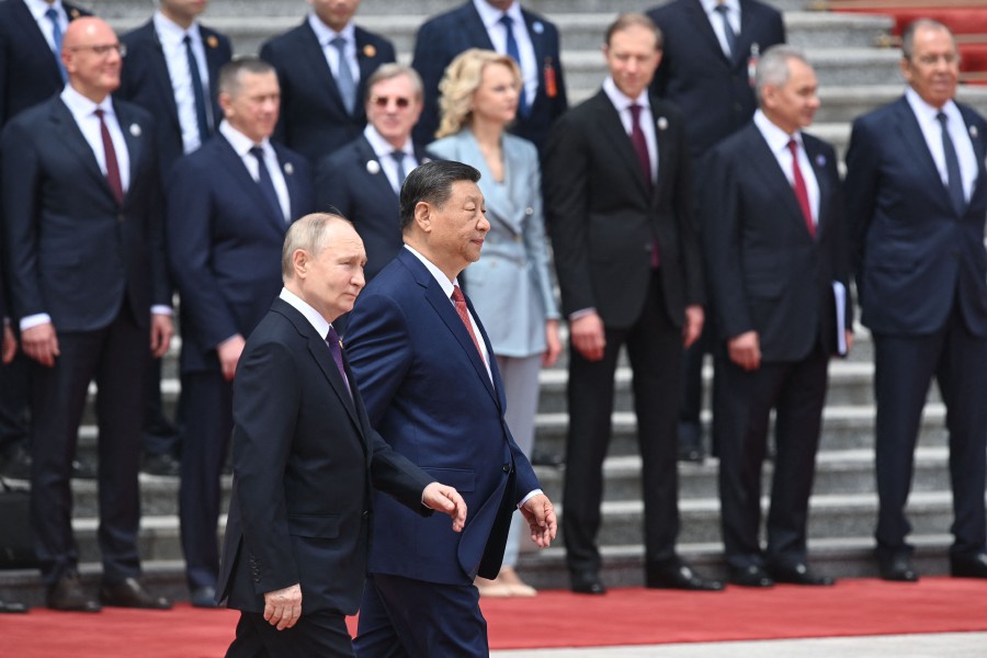 Russia's President Vladimir Putin and China's President Xi Jinping attend an official welcoming ceremony in front of the Great Hall of the People in Tiananmen Square in Beijing. - AFP PIC