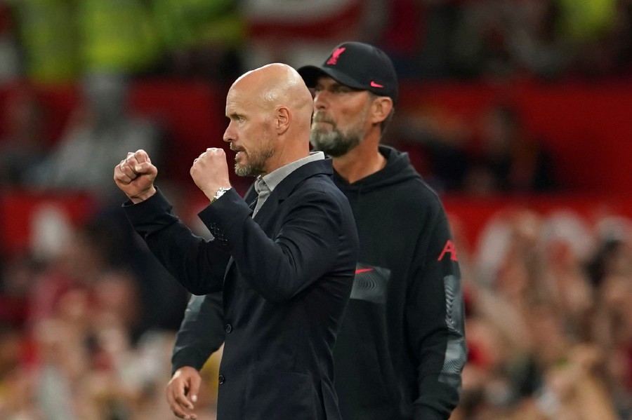 Manchester United's head coach Erik ten Hag celebrates at the end the English Premier League soccer match between Manchester United and Liverpool at Old Trafford stadium, in Manchester. In background is Liverpool's manager Jurgen Klopp. - AP PIC
