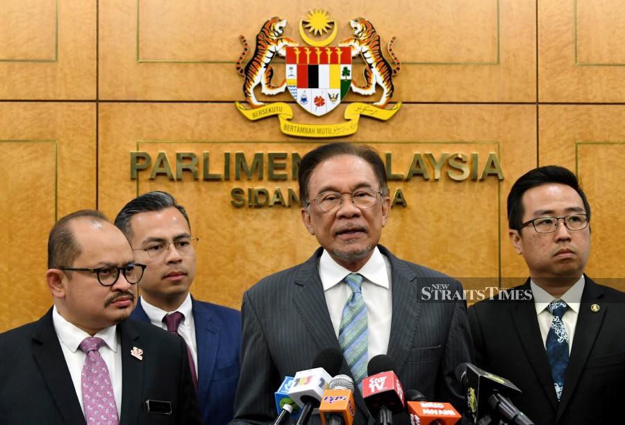 PKR president Datuk Seri Anwar Ibrahim addresses the media at the Parliament lobby in Kuala Lumpur. - Bernama.