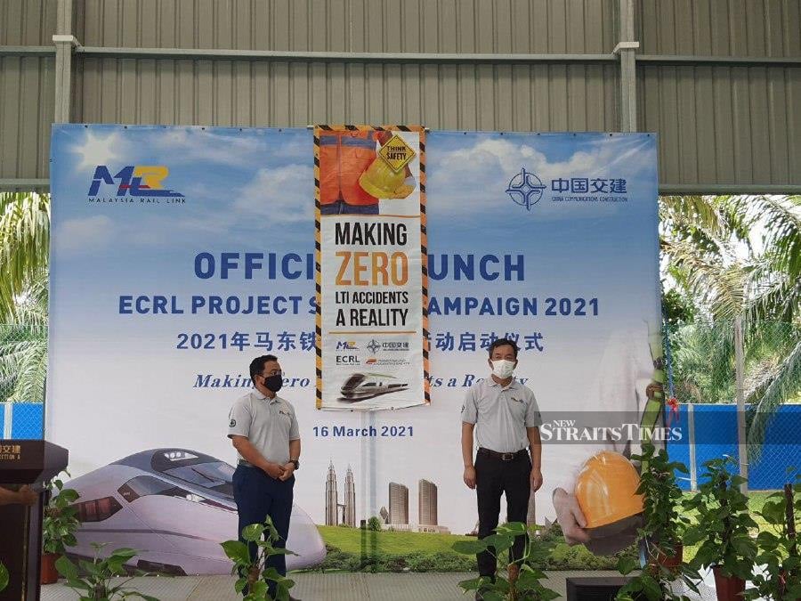 MRL chief executive officer Datuk Seri Darwis Abdul Razak (left) and CCC-ECRL managing director Bai Yinzhan launching the CCC-ECRL's Safety Campaign 2021 in Maran. - Pix courtesy of CCC-ECRL.