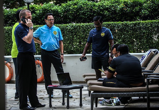 Ong Kim Swee with his assistants during Harimau Malaya light training at Hilton PJ pool. National youth coach Ong Kim Swee has been placed in temporary charge of the national team ollowing Dollah Salleh's decision to quit after the 10-0 thrashing by the United Arab Emirates in Abu Dhabi. Pix by Osman Adnan