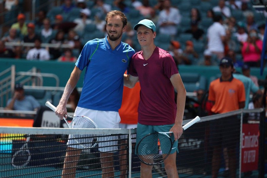 Daniil Medvedev of Russia, right, poses after winning the final