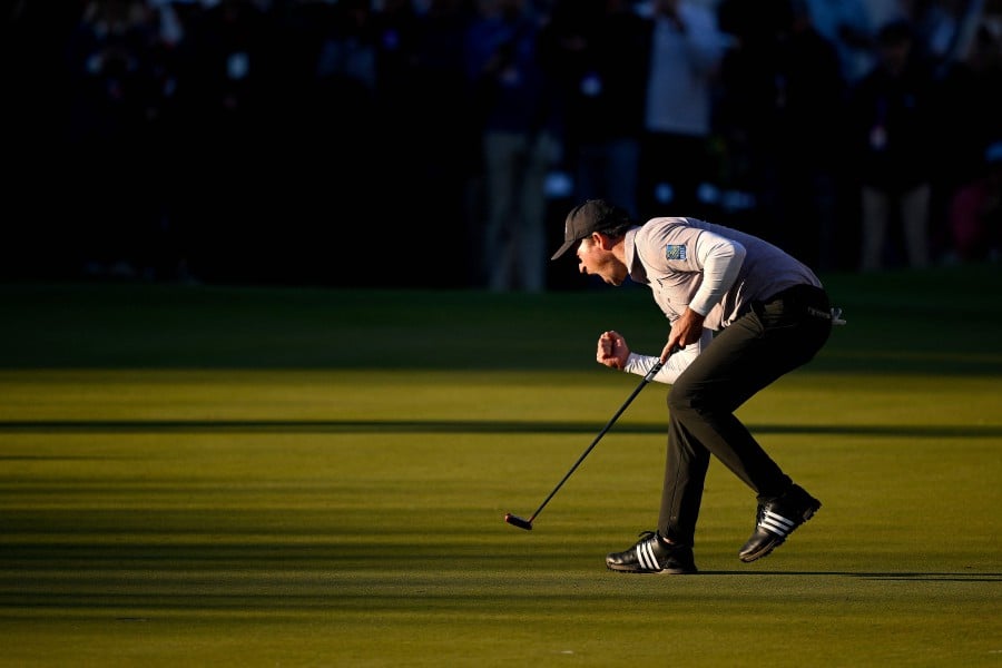 Nick Taylor of Canada celebrates making his putt on the 18th green to tie for the lead and force a playoff during the final round of the WM Phoenix Open at TPC Scottsdale in Scottsdale, Arizona. .-AFP PIC 