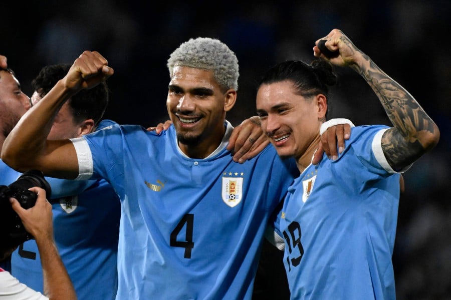 Uruguay's defender Ronald Araujo (L) and forward Darwin Nunez (R), the players who scored for Uruguay to defeat Argentina, pose for a picture at La Bombonera stadium in Buenos Aires. - AFP PIC