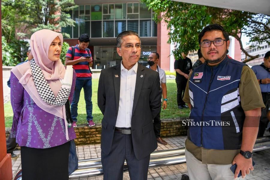 (From left) Nurul Izzah Anwar with the Malaysian Parliament Caucus for Palestine head Syed Ibrahim Syed Noh and Global Peace Malaysia chief executive officer Syahrir Azfar Saleh after presenting the notice of protest at the US Embassy in Kuala Lumpur. 