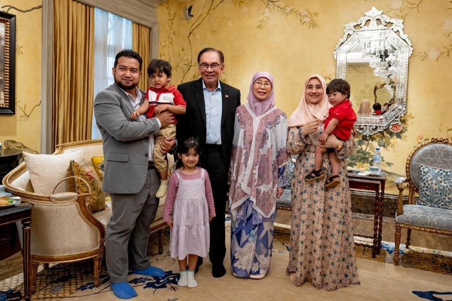 Prime Minister Datuk Seri Anwar Ibrahim and his wife, Datuk Seri Dr Wan Azizah Wan Ismail, with Muhammad Nadir Al-Nuri and his family at the Seri Perdana Complex in Putrajaya. - Pic credit Facebook anwaribrahimofficial