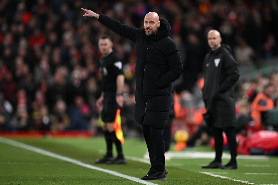 Manchester United's Dutch manager Erik ten Hag shouts instructions to the players from the touchline during the match against Liverpool at Anfield in Liverpool. - AFP PIC
