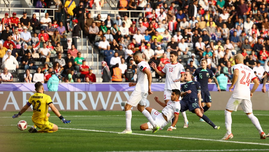 Australia's Jackson Irvine scores their first goal against Syria at the Jassim bin Hamad Stadium, Al Rayyan, Qatar. - REUTERS PIC