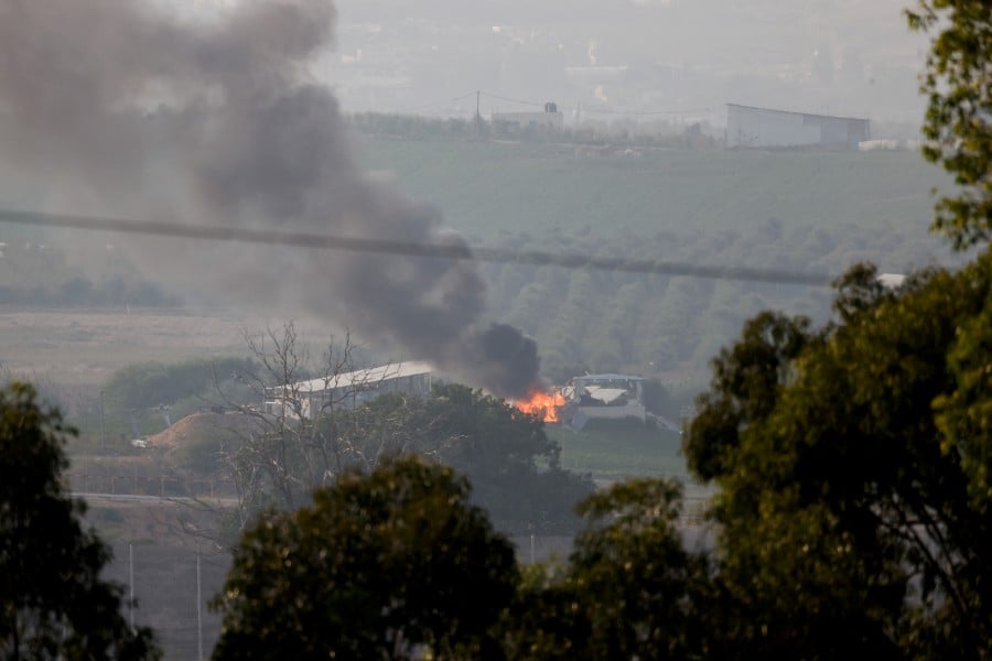 Smoke rises over Gaza, as seen from Israel's border with Gaza. - REUTERS PIC