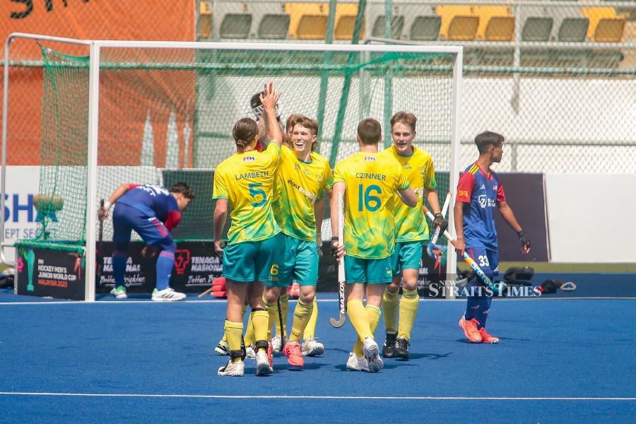 Australia’s Henderson Liam (2nd-left) celebrates with teammates after scoring a goal against Malaysia at the National Hockey Stadium in Bukit Jalil. -NSTP/GENES GULITAH