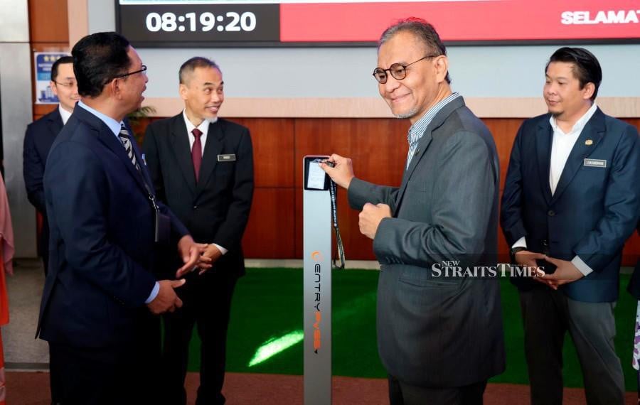 Health Minister Datuk Seri Dr Dzulkefly Ahmad clocking in at work at the ministry headquarters in Putrajaya. - Pic courtesy of the ministry. 