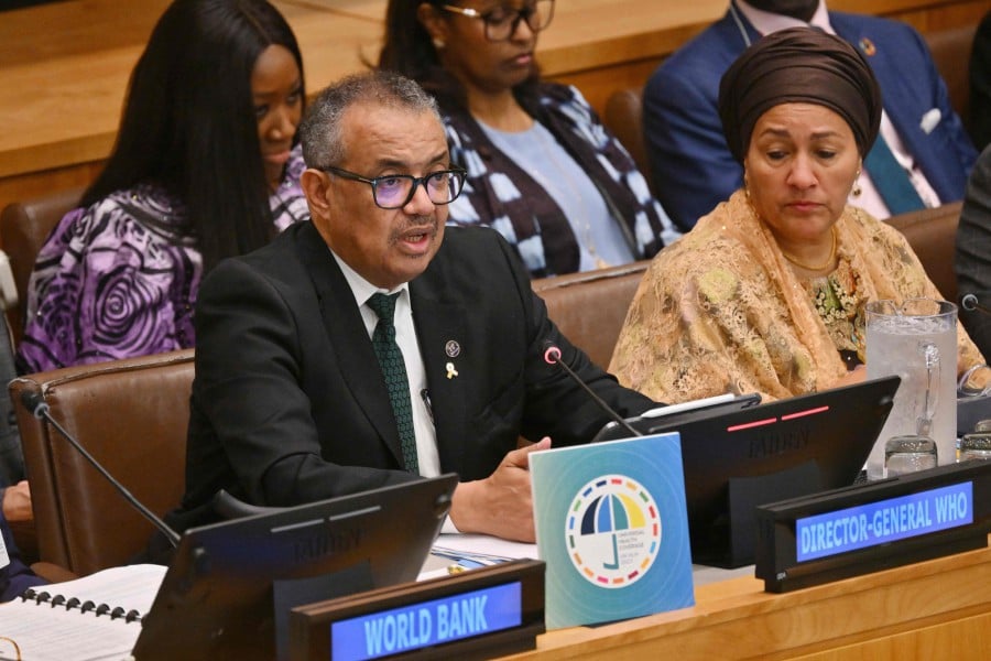 Director General of the World Health Organization, Tedros Adhanom Ghebreyesus, with UN Deputy Secretary-General Amina Mohammed (R), speaks at a meeting on universal health coverage on the sidelines of the UN General Assembly at UN headquarters in New York City. - AFP PIC