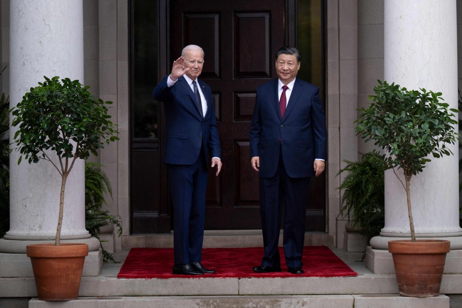 US President Joe Biden greets Chinese President Xi Jinping before a meeting during the Asia-Pacific Economic Cooperation (APEC) Leaders' week in Woodside, California. - AFP PIC