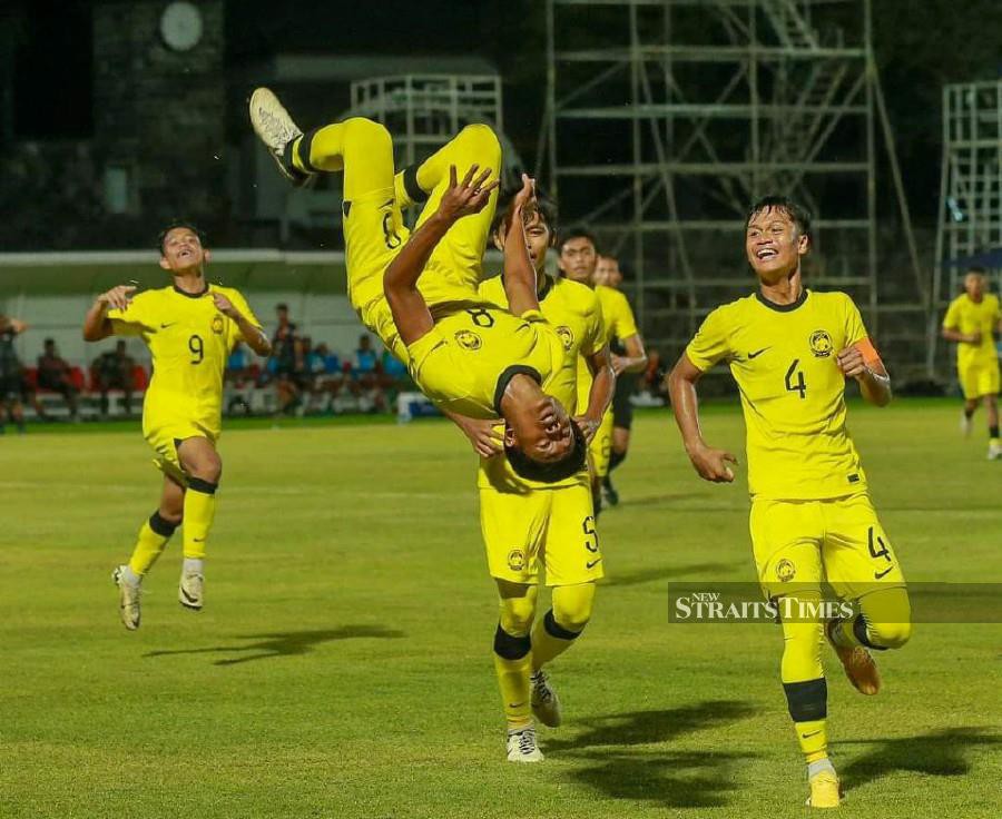  Malaysia players celebrate scoring against Timor Leste during Sunday's Under-16 Asean Championship match in Surakarta. -Pic courtesy of FAM