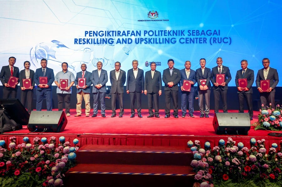 Deputy Prime Minister Datuk Seri Dr Ahmad Zahid Hamidi, Higher Education Minister Datuk Seri Mohamed Khaled Nordin and Agriculture and Food Security Minister, Datuk Seri Mohamad Sabu, during the launch ceremony of the Polytechnic Transformation Programme 2023-2030 at the Putrajaya International Convention Center (PICC). - BERNAMA PIC
