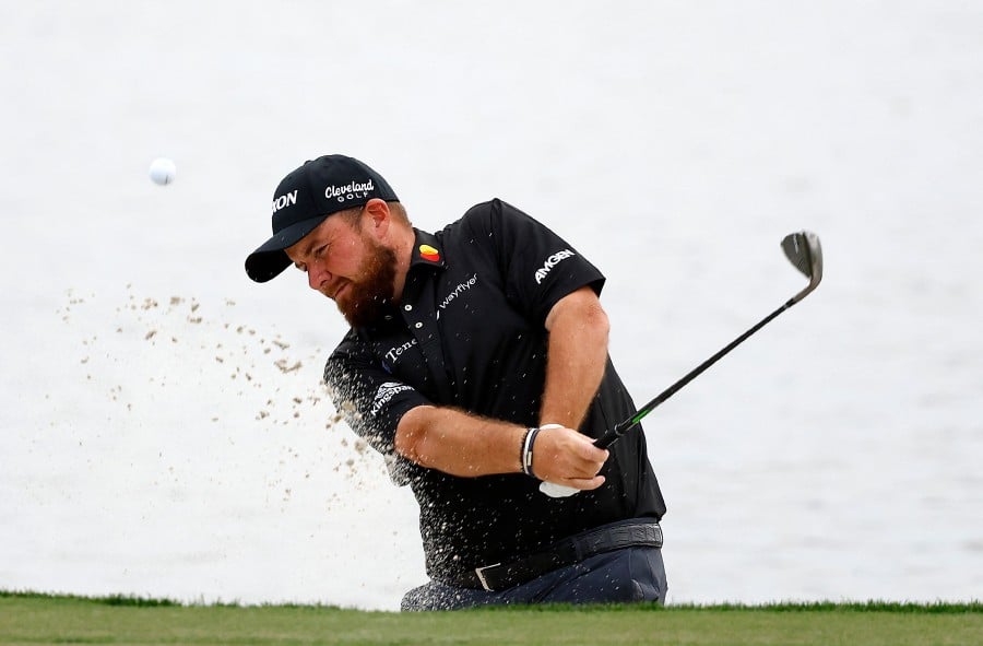  Shane Lowry of Ireland plays a shot from a bunker on the 18th hole during the third round of The Cognizant Classic in The Palm Beaches at PGA National Resort And Spa in Palm Beach Gardens, Florida. -AFP PIC