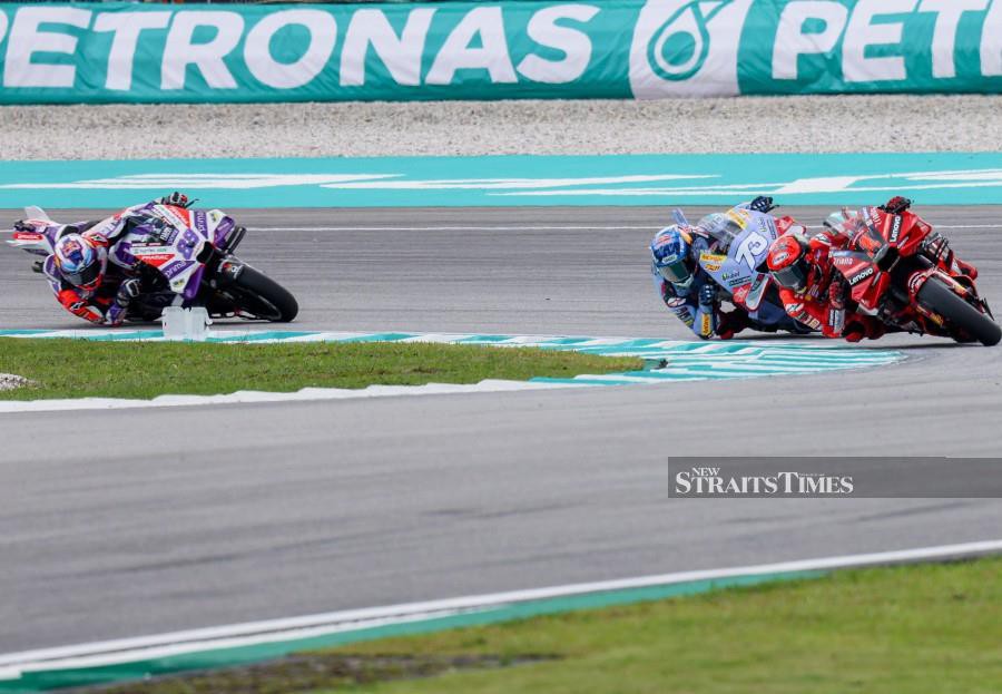 (From right) Francesco Bagnaia, Alex Marquez and Jorge Martin in action during the ‘Sprint’ event at the Petronas Grand Prix of Malaysia in Sepang. - NSTP/OSMAN ADNAN 