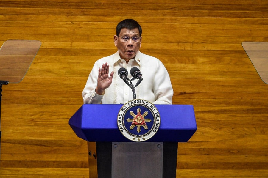 Former president Rodrigo Duterte has denied he threatened to kill a congresswoman and urged state prosecutors to refrain from filing criminal charges against him. - AFP PIC