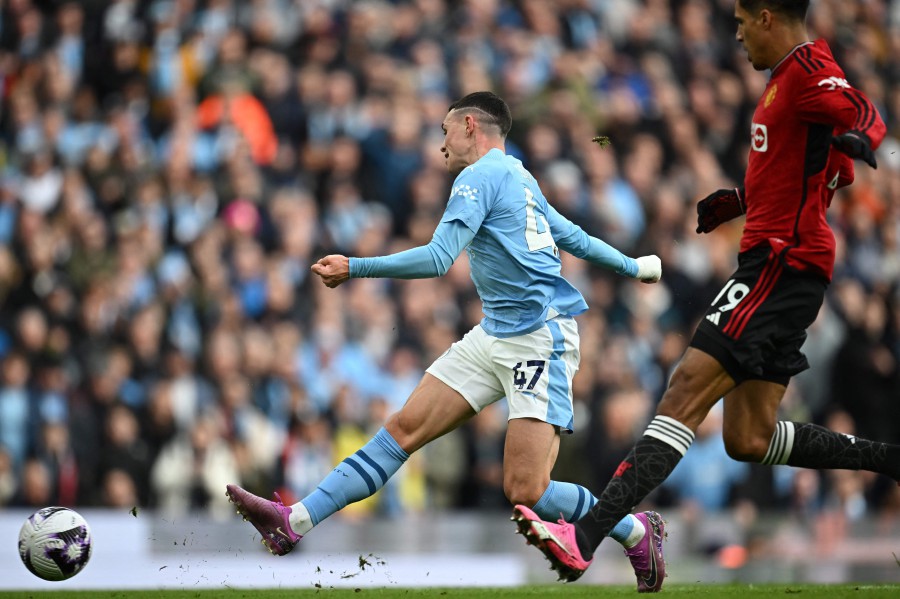 Manchester City's Phil Foden has an unsuccessful attempt during the English Premier League football match between Manchester City and Manchester United at the Etihad Stadium in Manchester. - AFP PIC