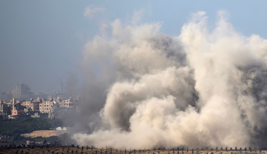 This picture taken from southern Israel near the border with the Gaza Strip shows smoke billowing following an Israeli strike on the Palestinian territory. - APF PIC