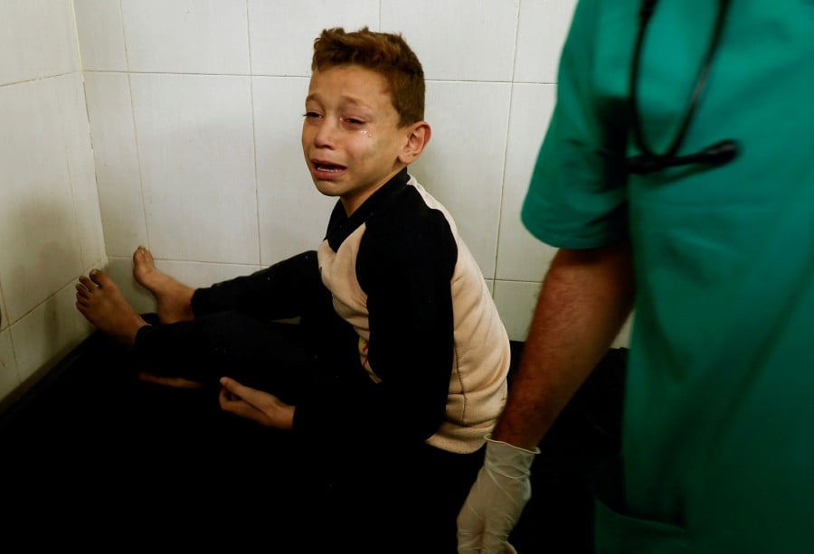 A Palestinian child wounded in an Israeli strike reacts at Nasser hospital, amid the ongoing conflict between Israel and Hamas, in Khan Younis in the southern Gaza Strip. - REUTERS PIC
