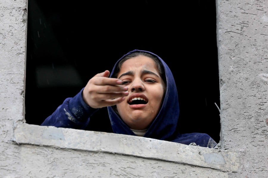 A Palestinian girl reacts following an Israeli strike on Rafah in the southern Gaza Strip. - AFP PIC