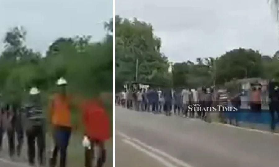 This viral image shows a large group of foreign workers walking in Kota Tinggi, Johor, recently.