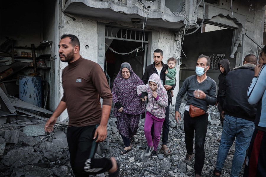  People flee following an Israeli strike in Rafah in the southern Gaza Strip. - AFP PIC