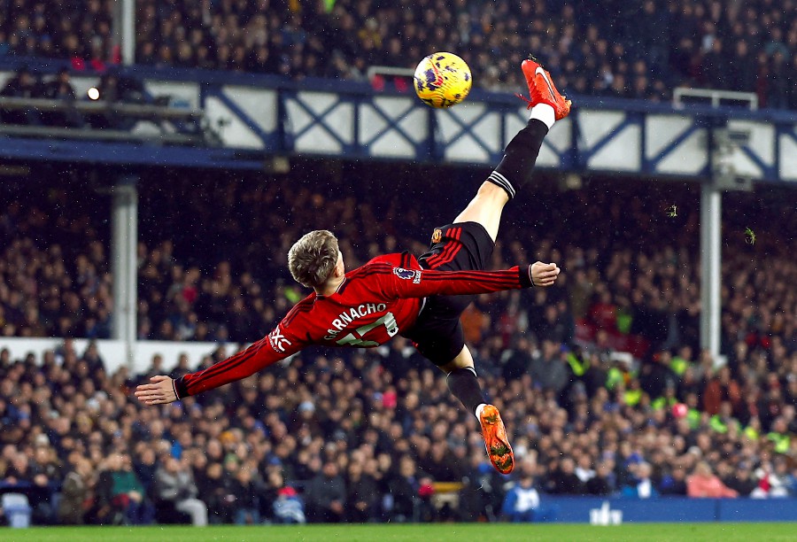 Manchester United's Alejandro Garnacho scores their first goal against Everton at the Goodison Park, Liverpool. - REUTERS PIC