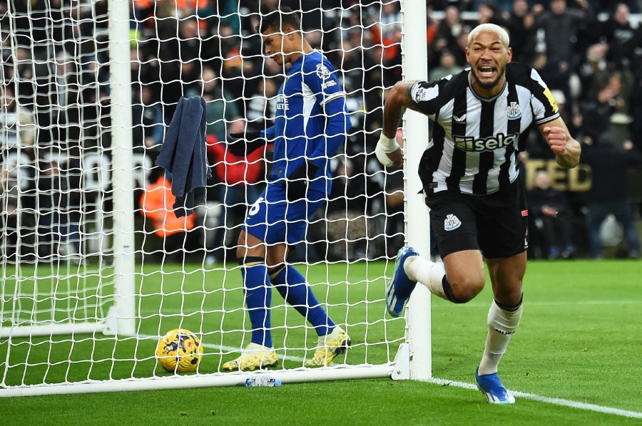  Newcastle United's Joelinton celebrates scoring the team's third goal during the English Premier League football match between Newcastle United and Chelsea at St James' Park in Newcastle. - AFP PIC