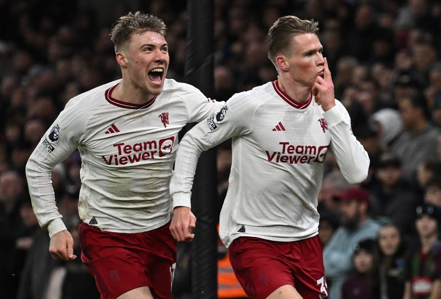 Manchester United's Scott McTominay celebrates scoring the team's second goal with Rasmus Hojlund during the English Premier League football match between Aston Villa and Manchester United at Villa Park in Birmingham. - AFP PIC