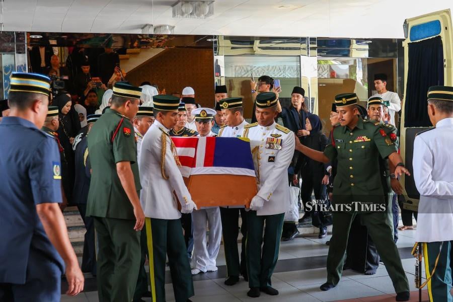 The remains of Tun Abdul Taib Mahmud are brought out of the National Mosque before being transported to Sultan Abdul Aziz Shah International Airport in Subang.- NSTP/ASWADI ALIAS