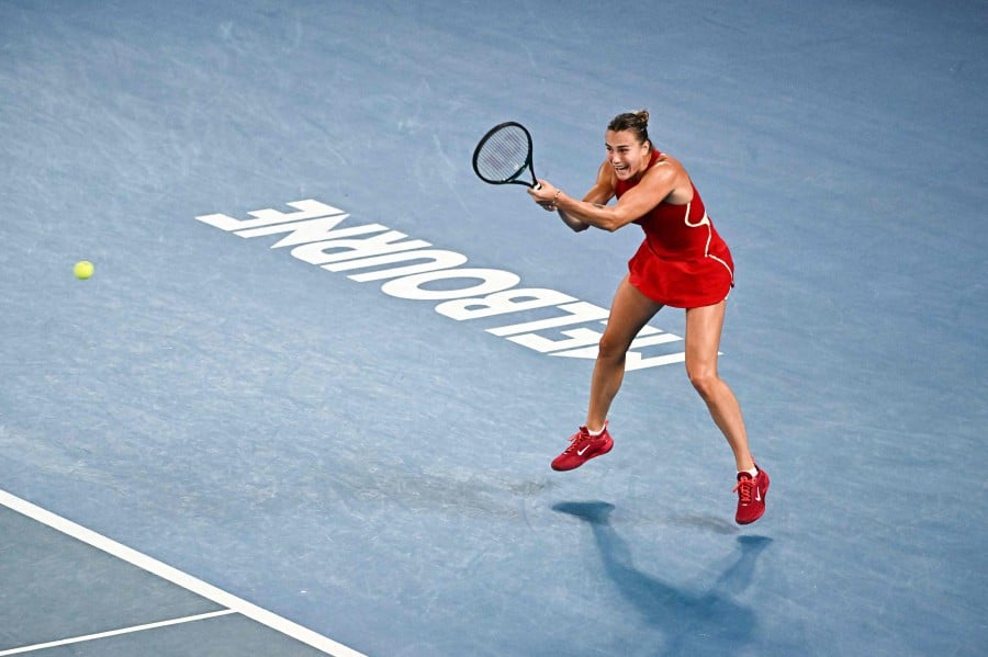 Belarus' Aryna Sabalenka hits a return against Czech Republic's Barbora Krejcikova during their women's singles quarter-final match on day 10 of the Australian Open tennis tournament in Melbourne. - AFP PIC