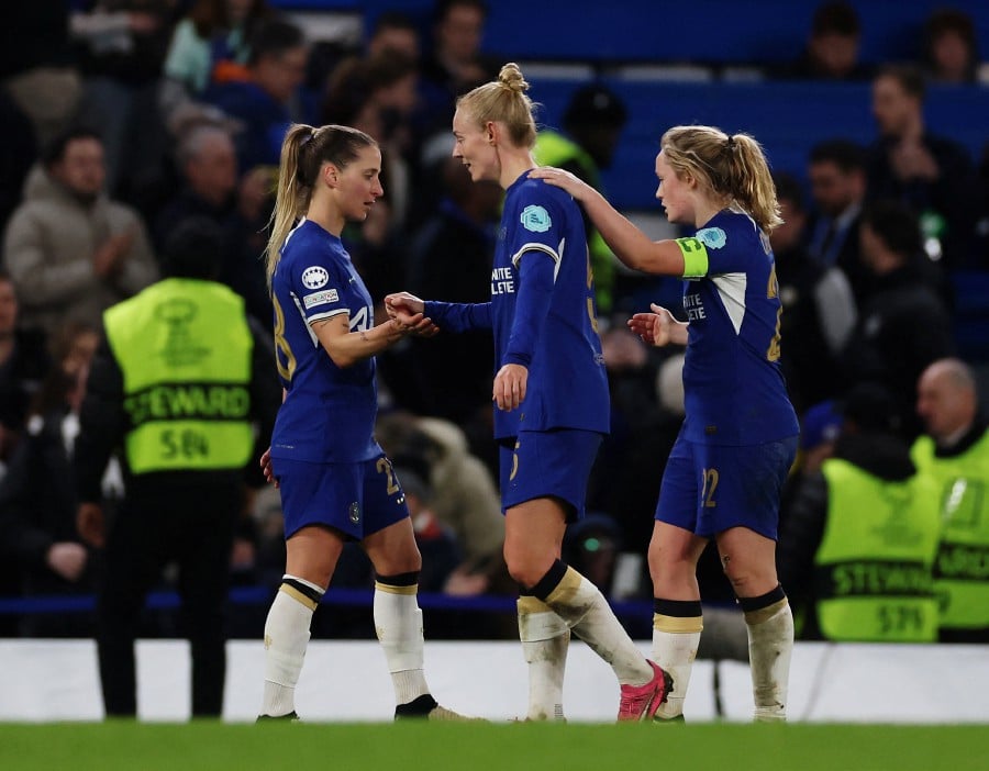 Chelsea's Erin Cuthbert celebrates with teammates after the match against Ajax at Stamford Bridge, London, Britain.-REUTERS PIC