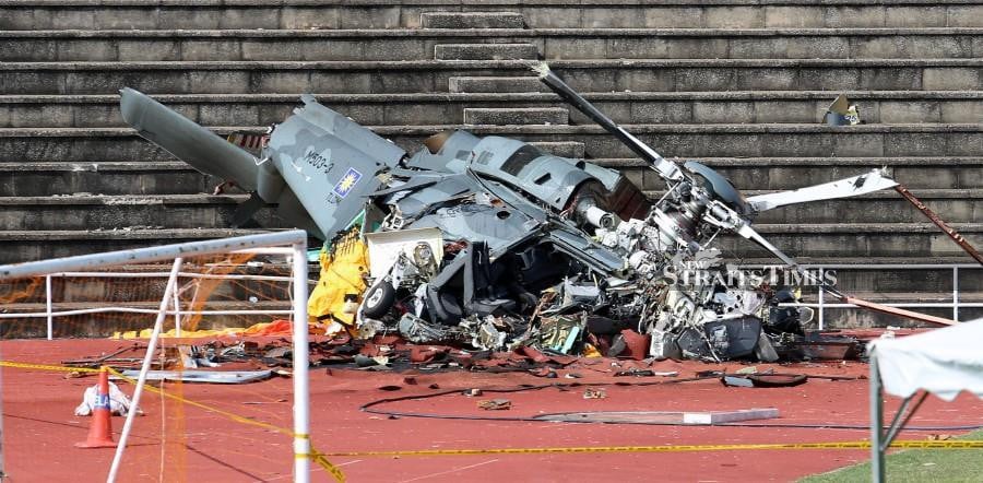 The wreckage of 503-3 Maritime Operations Helicopter (HOM) is seen on the steps of the Navy Stadium in Lumut. -NSTP/L. MANIMARAN