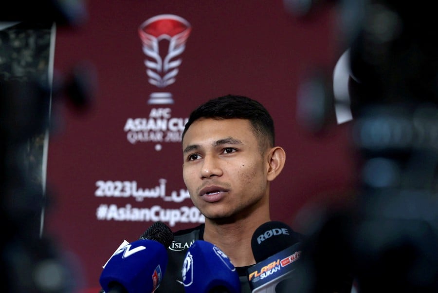 Faisal Halim speaking to reporters during a press conference in Doha. -NSTP/HAIRUL ANUAR RAHIM