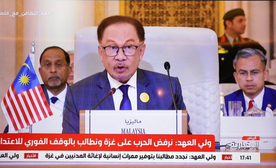 Prime Minister Datuk Seri Anwar Ibrahim addresses the 8th Extraordinary Islamic Summit of the Organisation of Islamic Cooperation (OIC) in Riyadh, Saudi Arabia. - BERNAMA PIC