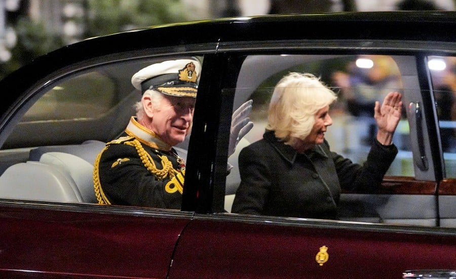 King Charles III and Camilla, the Queen Consort leave Westminster hall after a vigil during the Lying-in State of the late Queen Elizabeth II at Westminster Hall in London. - AP PIC